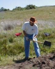 Jun Sunseri digging with shovel