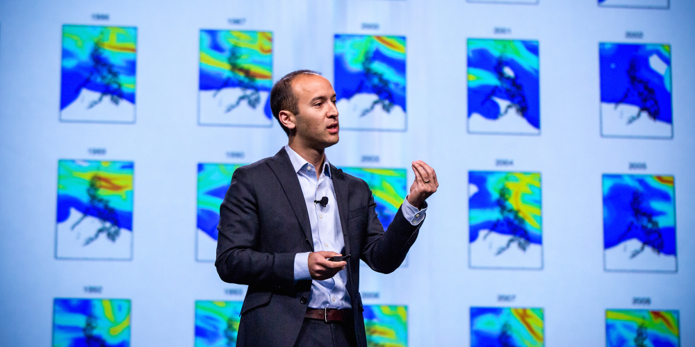 Solomon Hsiang in foreground with map images in background