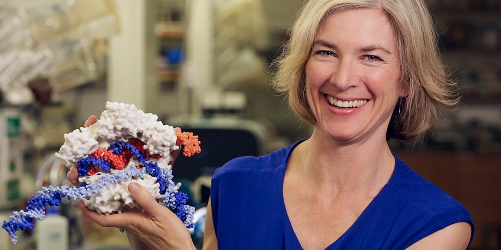 Jennifer Doudna holding an model of CRISPR.