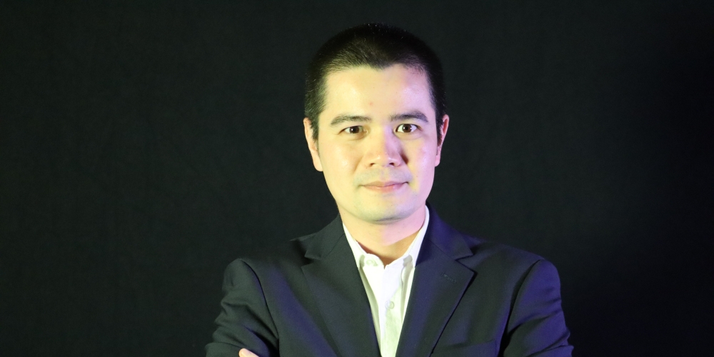headshot of Eos Trinidad
