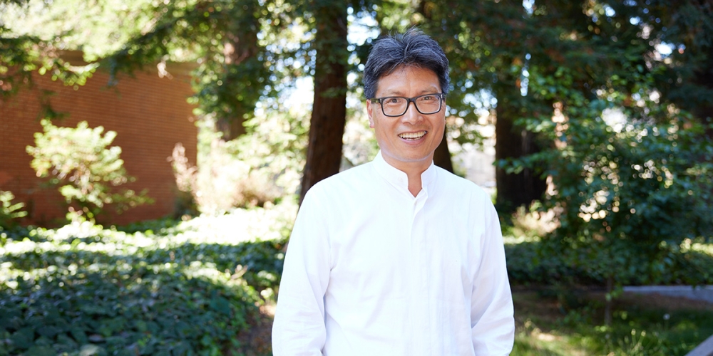 Chenxi Tang standing in outdoor setting