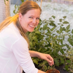 Britt Koskella in the greenhouse