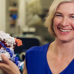 Jennifer Doudna holding an model of CRISPR.