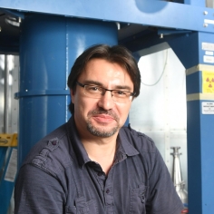 Yury Kolomensky in his lab