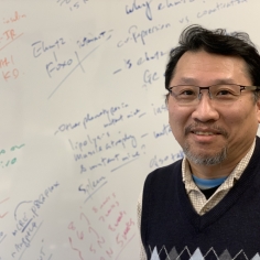 Wally Wang standing in front of a white board