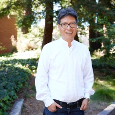 Chenxi Tang standing in outdoor setting 