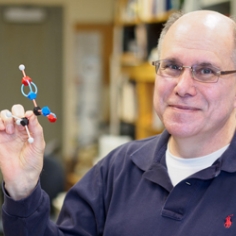 Gary Firestone holding a model