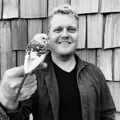 Richard Hindle with bird perched on finger