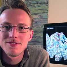 Image of Alexander Huth with brain images in background