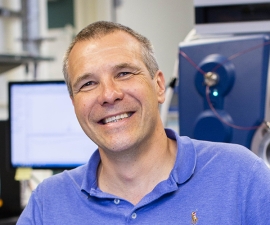 Professor Gronert in Front of a Mass Spectrometer