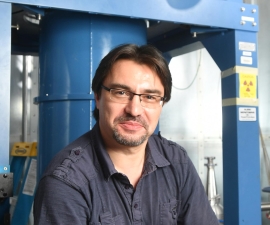 Yury Kolomensky in his lab