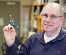 Gary Firestone holding a model