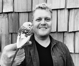 Richard Hindle with bird perched on finger