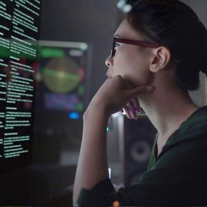 Woman looking intently at computer screen.