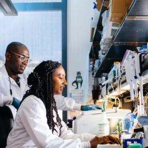 People standing at a lab bench.