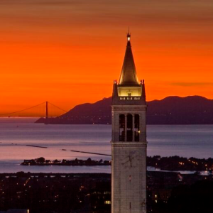 UC Berkeley campanile at sunset with Golden Gate Bridge in background
