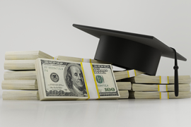 graduation cap and stacks of $100 bills