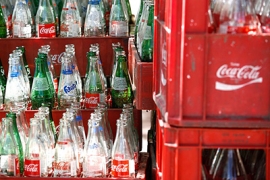 A photo of glass coca cola bottles