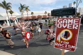 A group protests the Washington Redskins name across from Levi's Stadium before an NFL football game between the Redskins and the San Francisco 49ers.