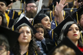 A Berkeley student who brought her son to the commencement ceremony symbolizes the value of university education across generations.