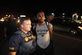 DeRay Mckesson is arrested by a police officer