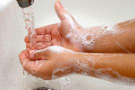 a stock image of someone washing hands