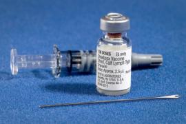 a syringe and bottled vaccine