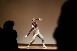 a woman dances on stage