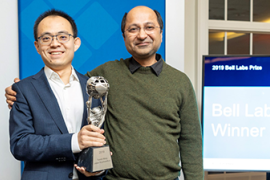 Jaijeet Roychowdhury and Tianshi Wang standing with Bell Labs Prize