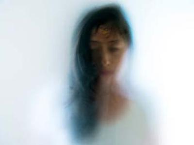 Picture of a Woman with her features blurred
