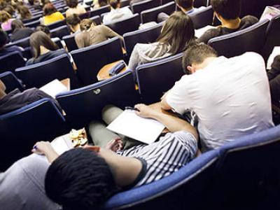 students slumped over in a lecture hall