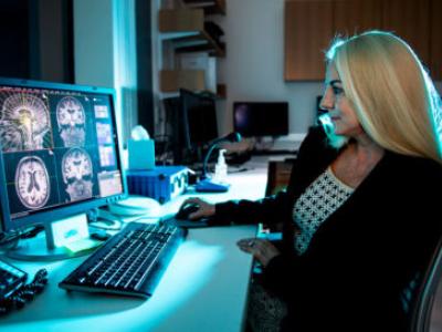 Susan Whitfield-Gabrieli, a psychology professor at Northeastern University, looks at children's brain scans.