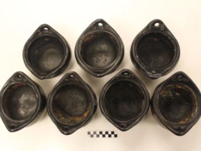 Seven La Chamba pots used in experiment on the residue of past meals cooked.
