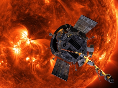 a satellite hovering over an angry red sun