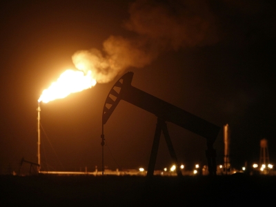 night turned red by flaring gas from oil well