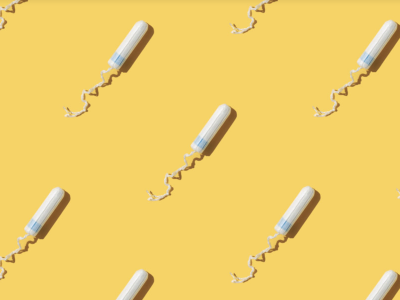 Graphic of tampons against a yellow background