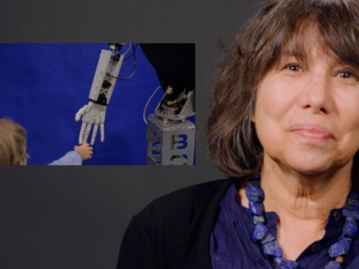 UC Berkeley psychology professor Alison Gopnik looks into the camera, next to a still picture of a robot hand reaching out towards a baby's hand.