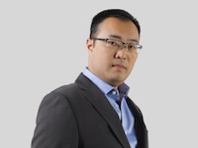 Daniel Nomura standing at 3/4 angle
