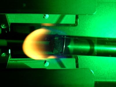 Flame spreading over a 12.7 mm sample at 19.8% oxygen under 60 kPa ambient pressure in microgravity. (Image courtesy of NASA)