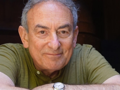 headshot of man crossing his arms