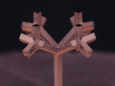 A 3D fractal tree antenna fabricated using charge programmed multi-material 3D printing (CPD).