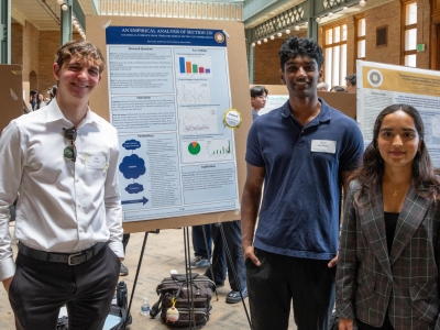 Students showing research at a poster session