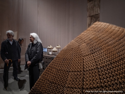 image of people standing admiring a piece of art