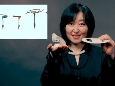 image of woman holding up props with a slide presentation overlay to her left