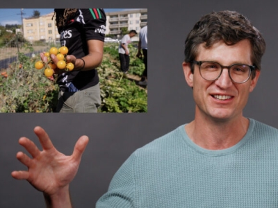 a smiling man on a field of gray with an inset image of a person's hands holding fresh tomatoes.