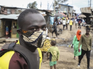 The driver of a motorcycle taxi in Kenya wears a makeshift mask to protect against the COVID19 virus. [AP photo by Patrick Ngugi]