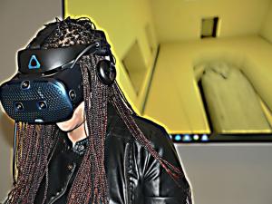 Jessica Johnson, a doctoral student in Egyptology, uses a Vive Cosmos VR headset to explore a recreation of the 2,500-year-old tomb of Psamtik.