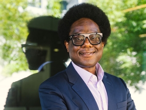 A photo of professor Osagie Obasogie outside a building