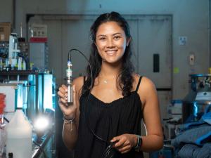 Researcher Brooke Chang holds isochoric chamber in the Rubinsky BioThermal Lab in Berkeley's Department of Mechanical Engineering.