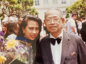 Old photo of Khatharya Um at her Berkeley graduation with her father